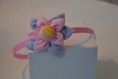 Bandolete rosa com flor.